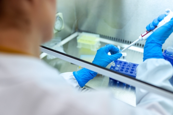 researcher processing samples