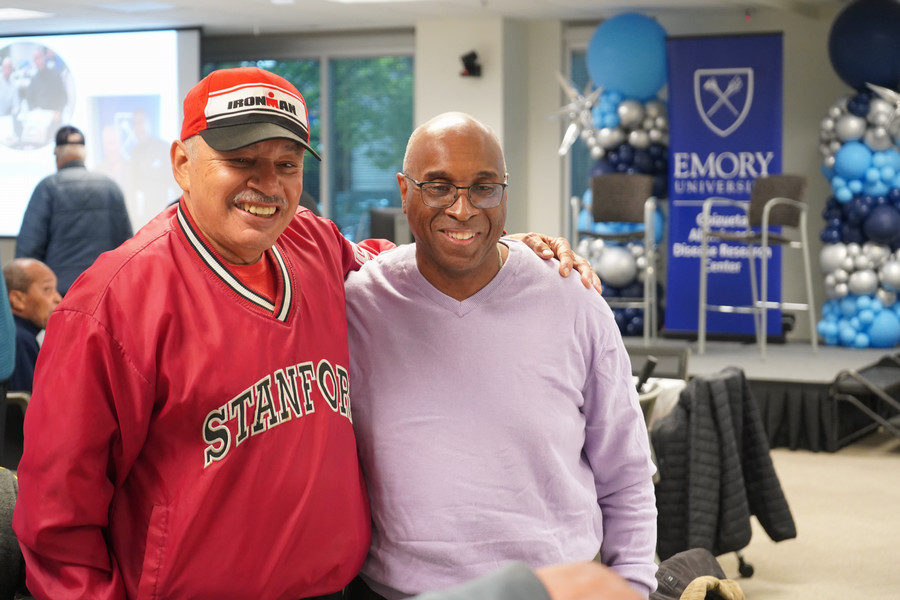 Men smiling and posing for a picture