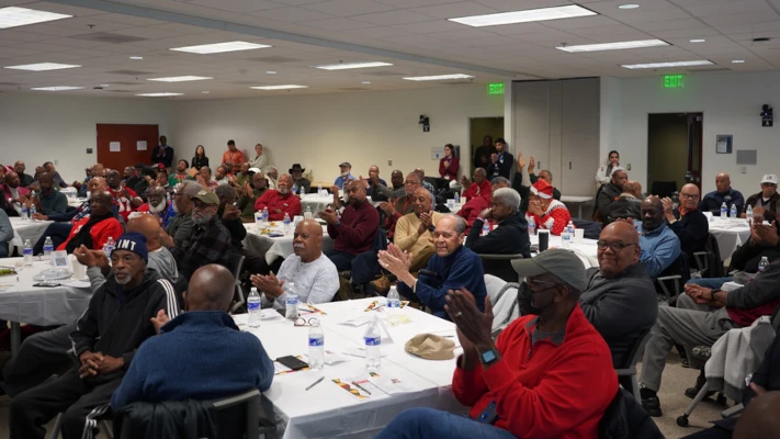 Attendees gathered at a Men's Health Program community event
